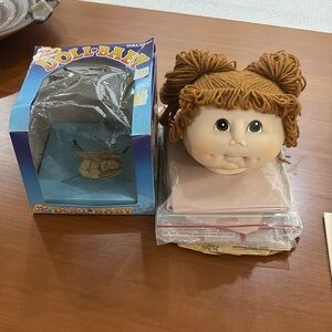 Vintage Doll Head. The Original Doll Baby doll head with Beige Fabric & pattern.